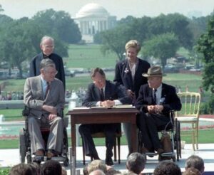 Image of George H.W. Bush signing the ADA